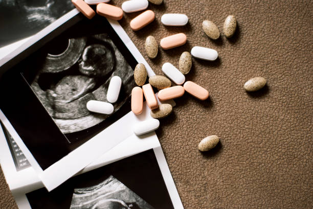 An ultrasound image beside various natural supplements on a brown textured surface.